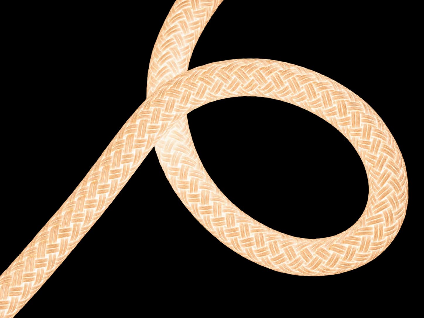 Illuminated braided cord, glowing warm white, looping down from the top of the frame
