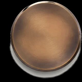 Aged Brass finish sample — hand-applied metal disc