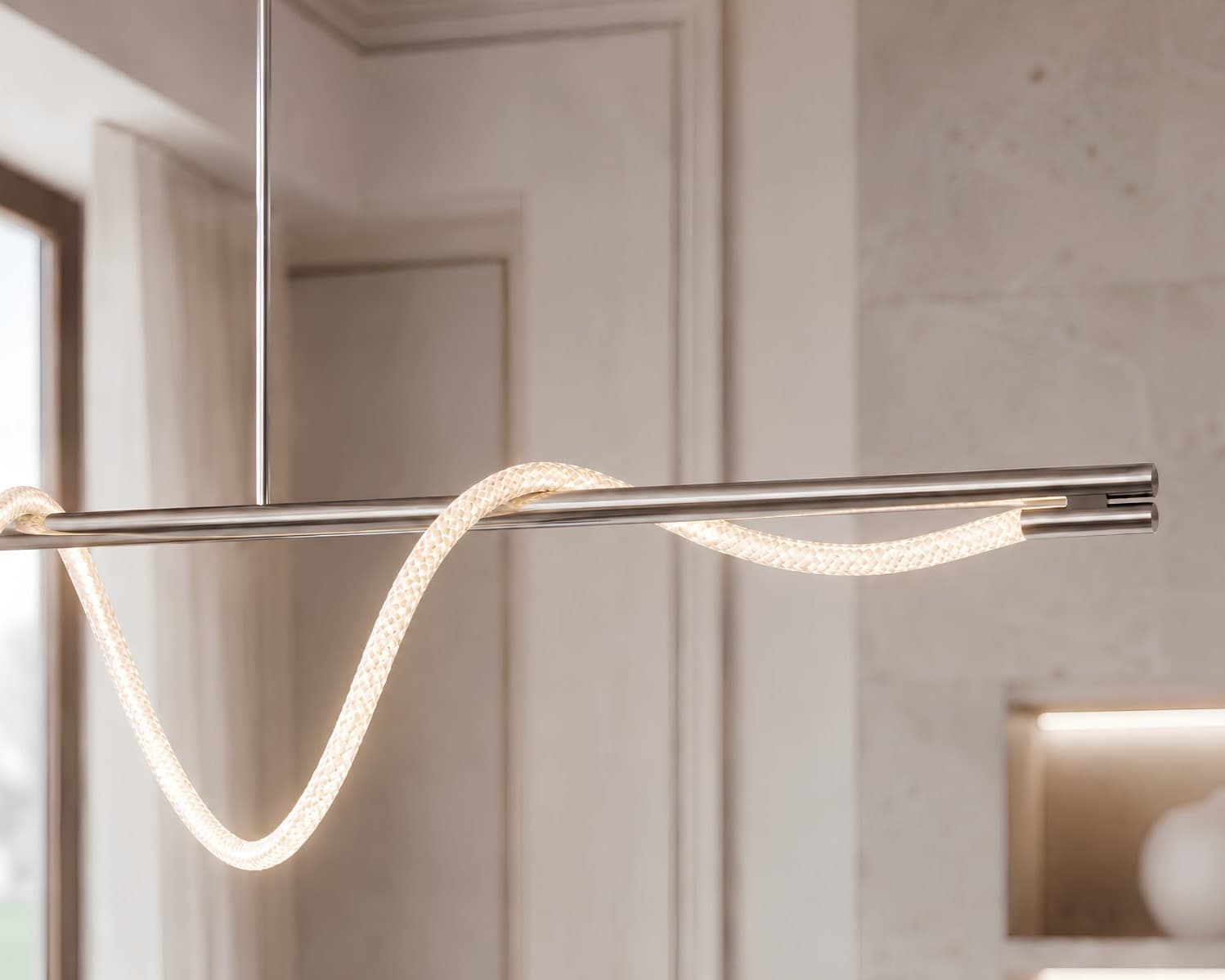 Eden Suspension in polished nickel — illuminated cord weaving along a horizontal rod-suspended frame